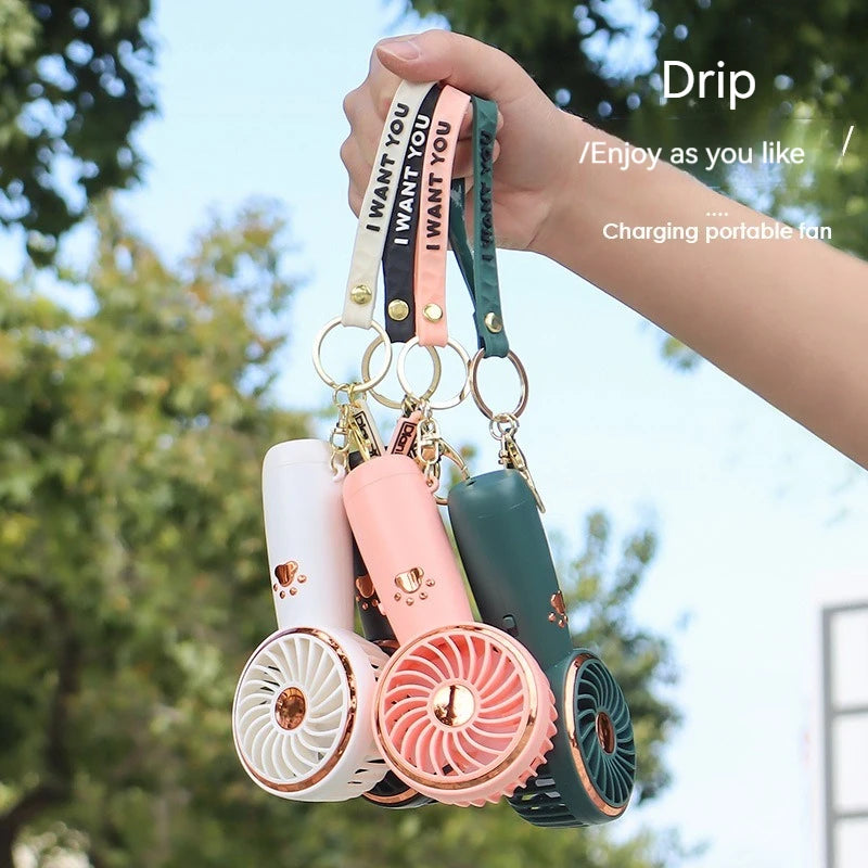 A summer new mini fan cute cartoon portable charging usb handheld student outdoor fan